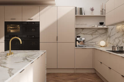 Fluted front kitchen Reed from Magnet in light warm neutral shade Shell, with a marbled splashback and worktop, brass tap in kitchen island sink