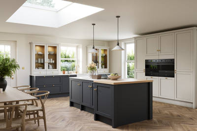 Contemporary Shaker kitchen island Ambleside from Magnet in deep blue shade Lake with beige tall cabinets, herringbone wood flooring and wood diningroom table