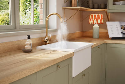 Contemporary Shaker kitchen Ambleside from Magnet in sage green shade Meadow with belfast sink and traditional style tap with hot water.