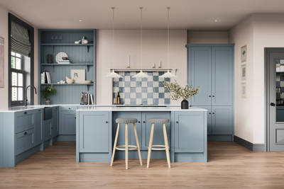 Premium Shaker kitchen Wardley Portland Blue including kitchen island with traditional detailing, black accessories, white worktop and matching blue open shelves with blue panelling and checkered tiling over range cooker.