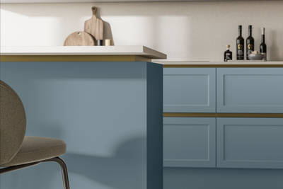 Integra Dunham Portland Blue, a handleless shaker frontal with brass details and a white worktop.