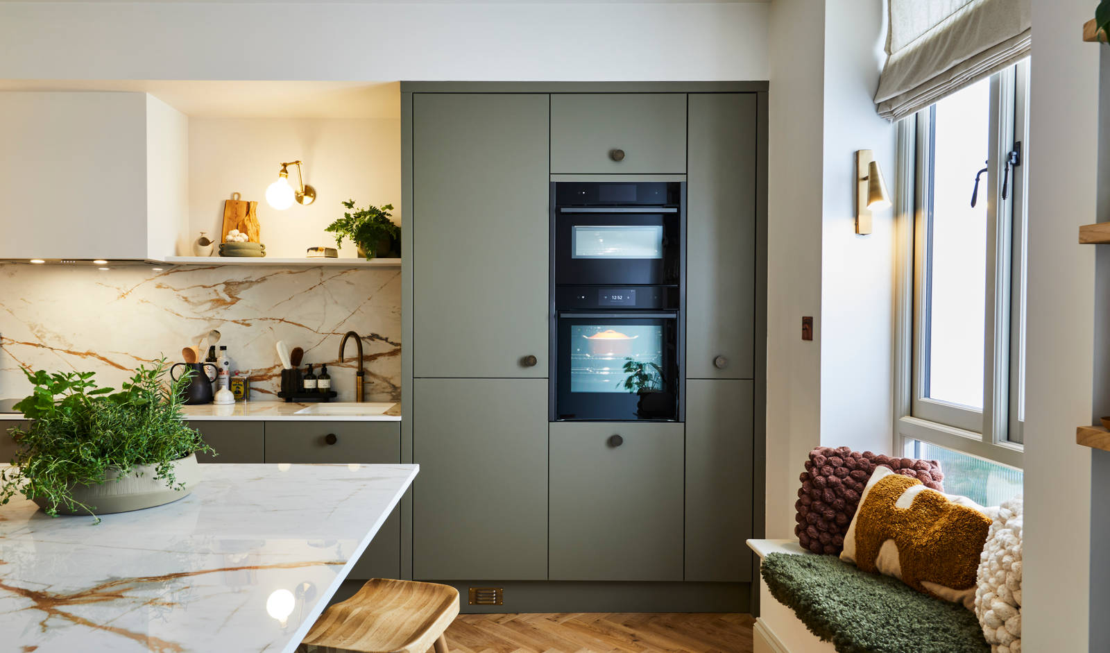 Modern slab Soho cabinets in the Balmoral colour, a soft beige green tone