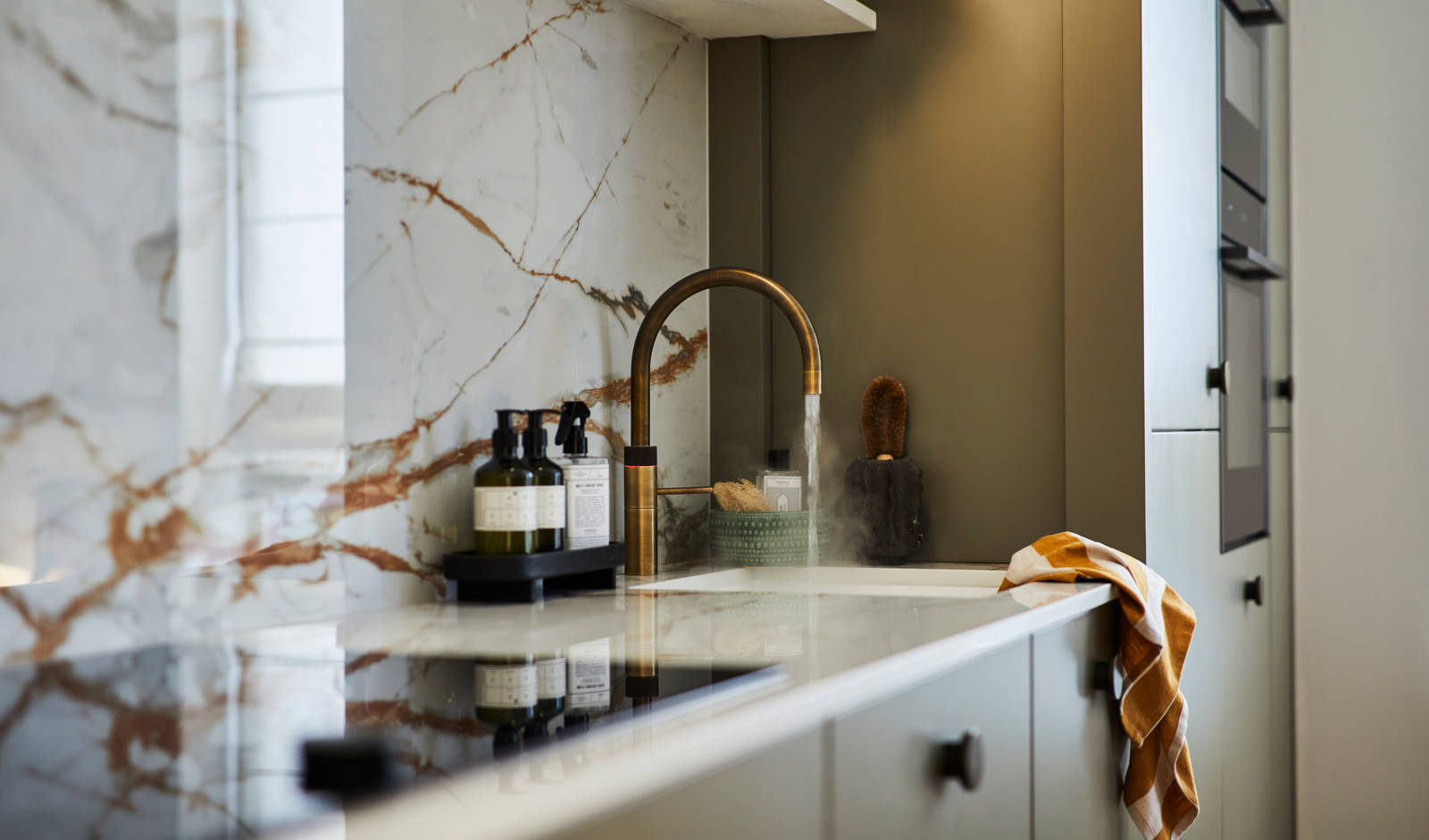 Modern slab Soho cabinets in the Balmoral colour, a soft beige green tone