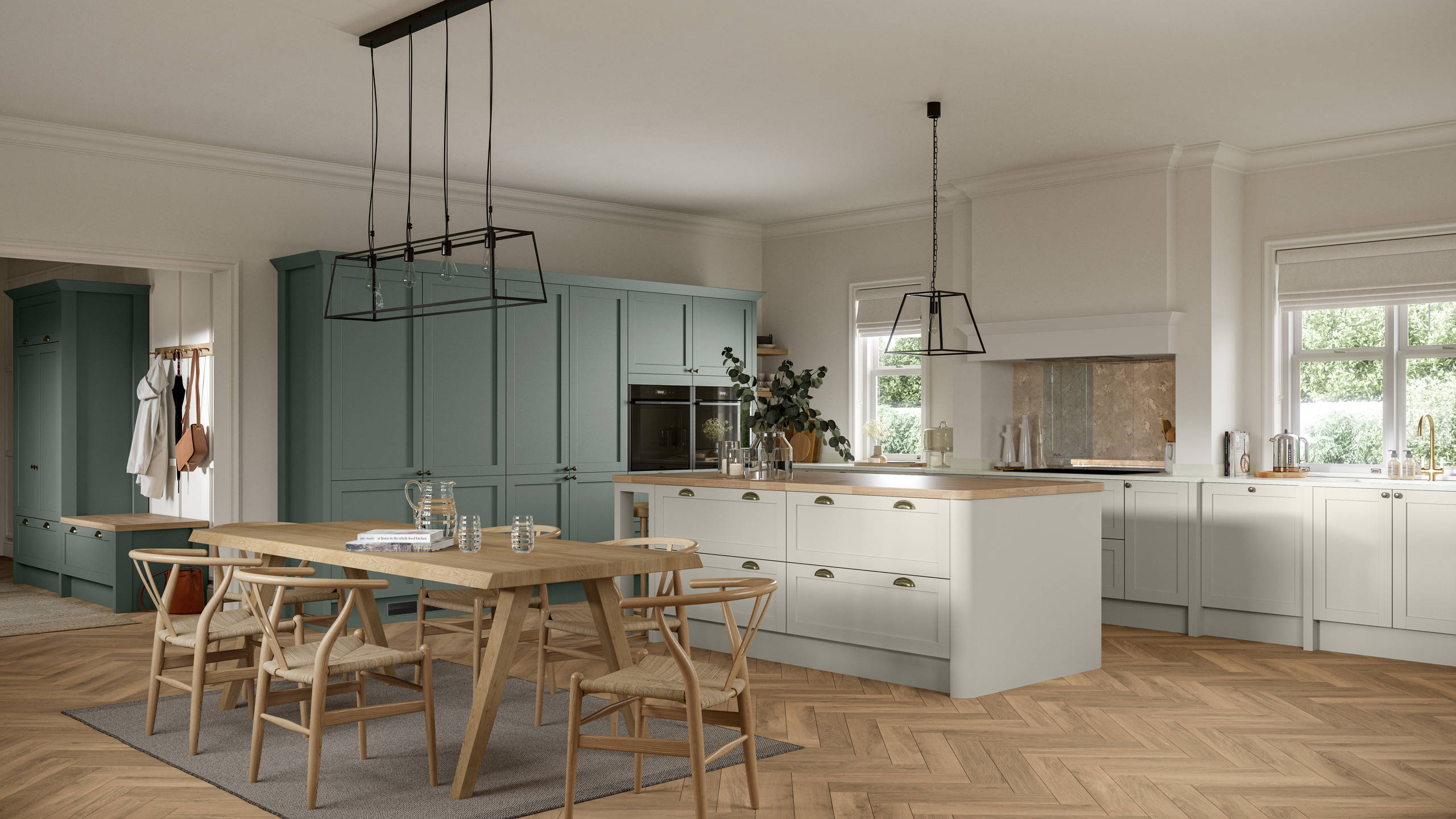 Ambleside Shaker kitchen in Moss and Limestone colours, featuring cup handles, and a spacious open-plan layout.