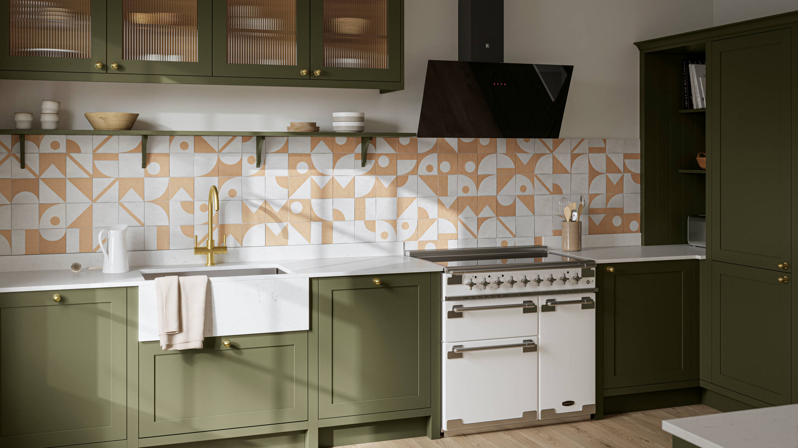 Premium Shaker kitchen Wardley Tailored green with traditional detailing, brass accessories, Elise range oven, screen extractor, white worktop and Classic Flint Grey oiled oak engineered wood flooring.
