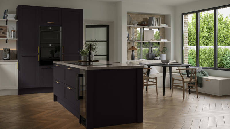 The Ambleside kitchen in a dark Graphite shade, in a contemporary kitchen setting with wooden herringbone flooring.