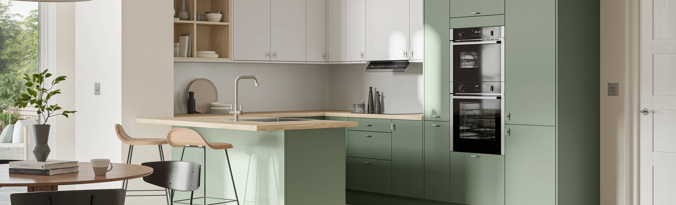 Contemporary scandinavian influenced Ascoli kitchen in fresh shade green Woodland and light grey, wall cabinets with timber accents like open shelves and oak laminate worktop, matched with oak laminate flooring and wood barstools at breakfast bar.