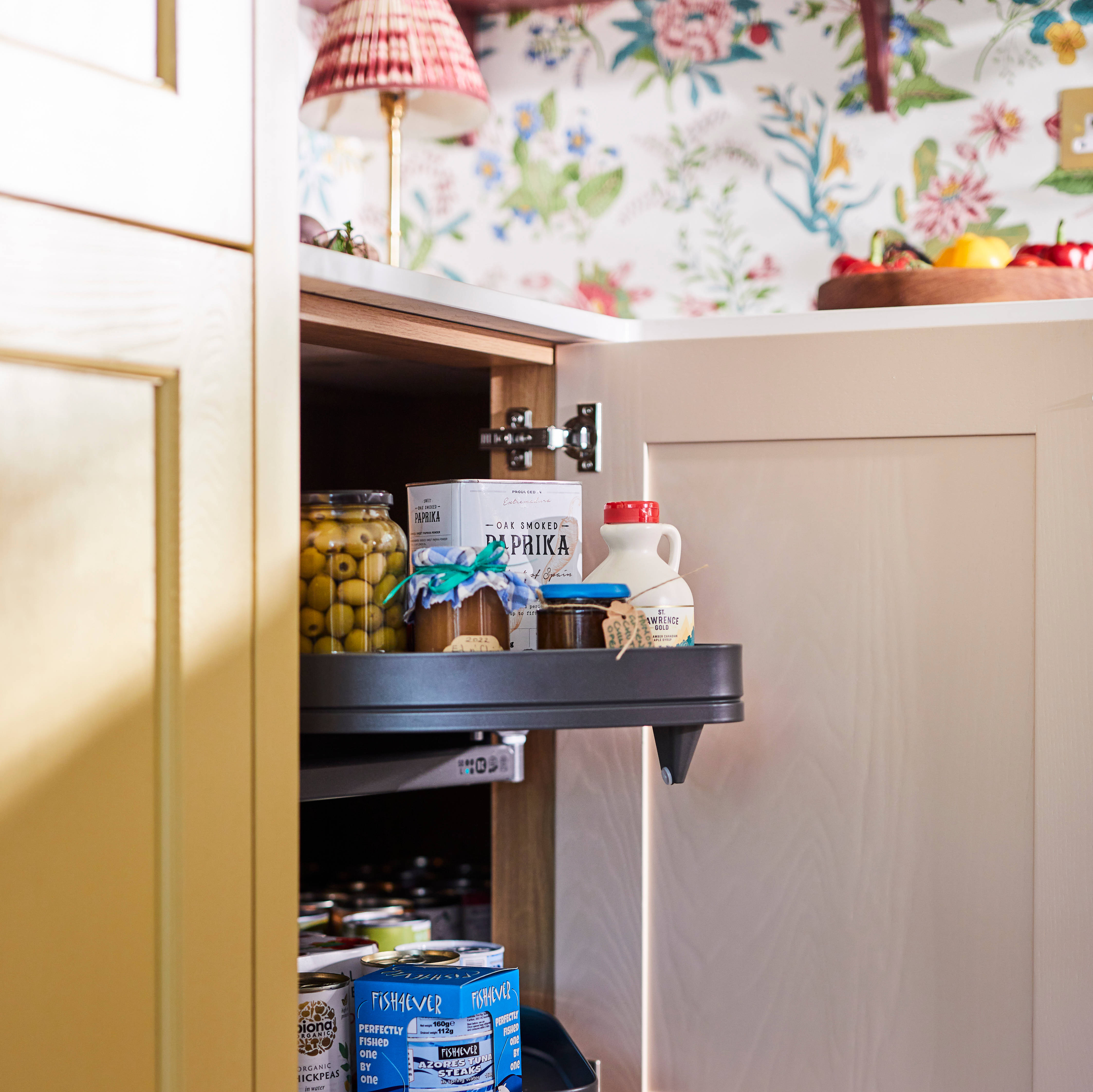 Open cabinet with pull-out corner storage solution