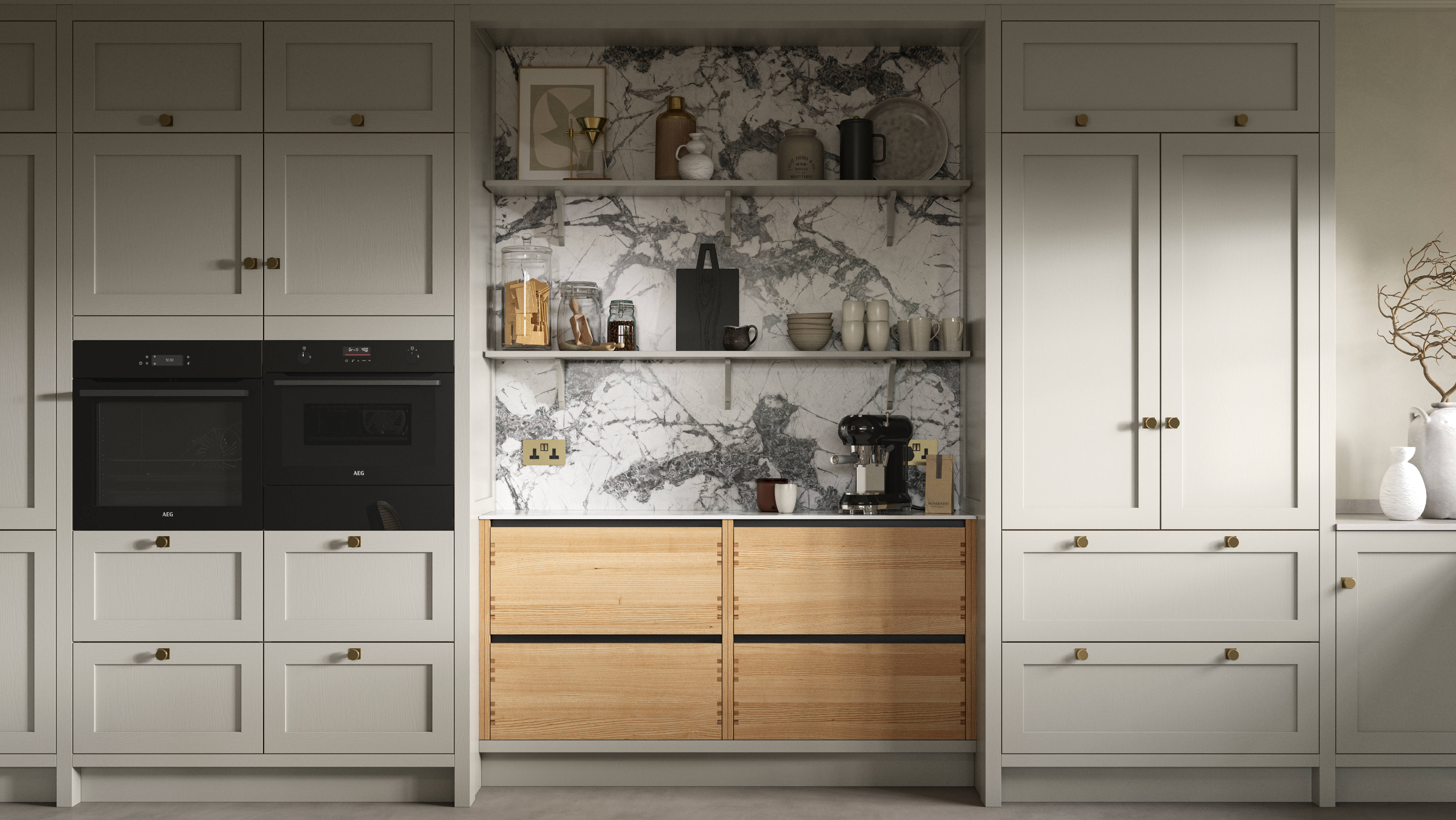 A neutral Shaker kitchen with Pebble and Nordic Craft cabinetry, marble splashback behind open shelves and paired with brass handles.