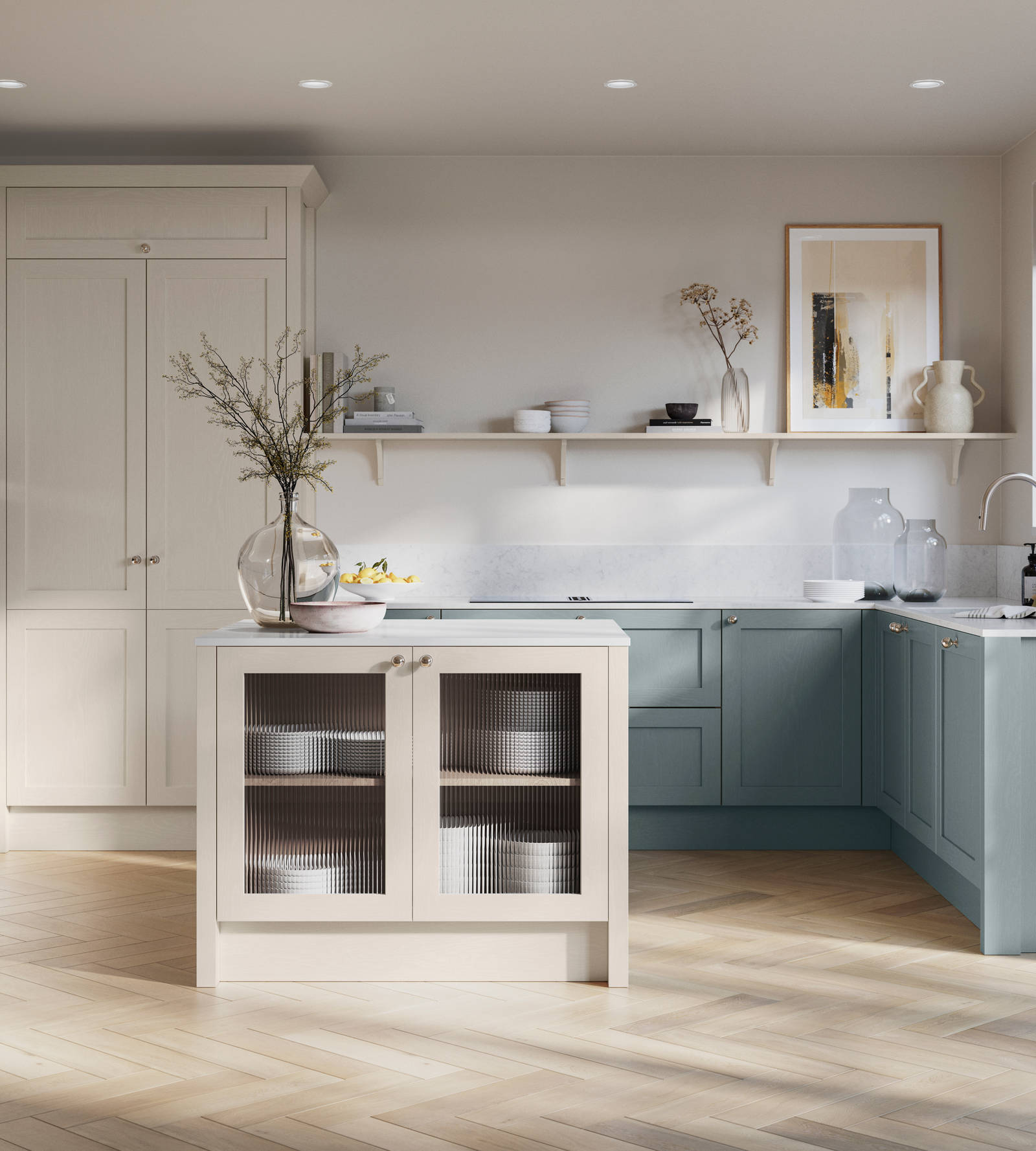Open floorplan kitchen with small kitchen island in Wardley kitchen from Magnet in the light shade Limestone as well as blue Duck egg, decorated with flowers in glass vases and earth toned ceramics.