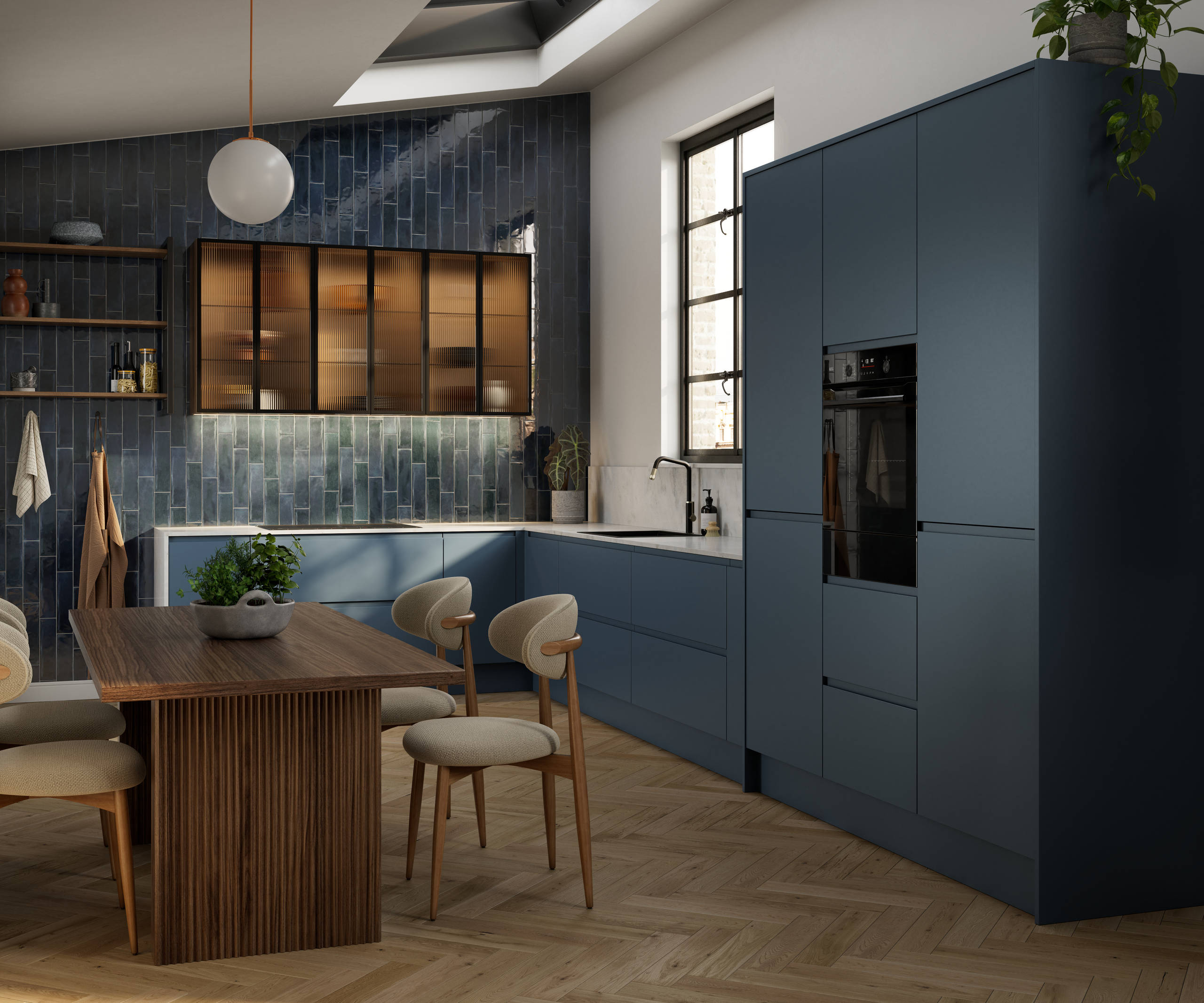 Contemporary and minimalist handleless kitchen with J-Pull door in dark blue shade Mineral Blue, with fluted glass vitrine wall cabinets and marbled worktop and matching upstand.