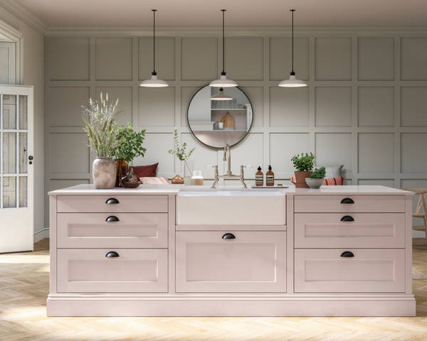 Ludlow kitchen. Our latest Shaker door, with a modern country-style. Here in the light pink shade Rose bowl, paired with plants in earth tone planters.