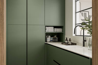 Integra Ascoli Woodland green, matt green slab fronts on handleless cabinets with white and grey marble worktop, matching upstand