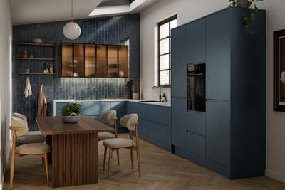 Contemporary and minimalist handleless kitchen with J-Pull door in dark blue shade Mineral Blue, with fluted glass vitrine wall cabinets and marbled worktop and matching upstand.