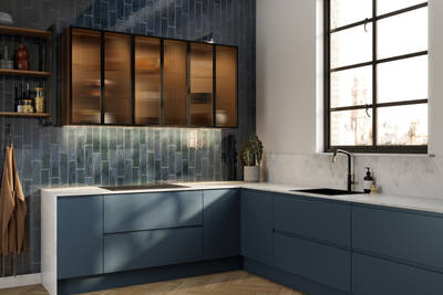 Contemporary and minimalist handleless kitchen with J-Pull door in dark blue shade Mineral Blue, with fluted glass vitrine wall cabinets and tiled wall.